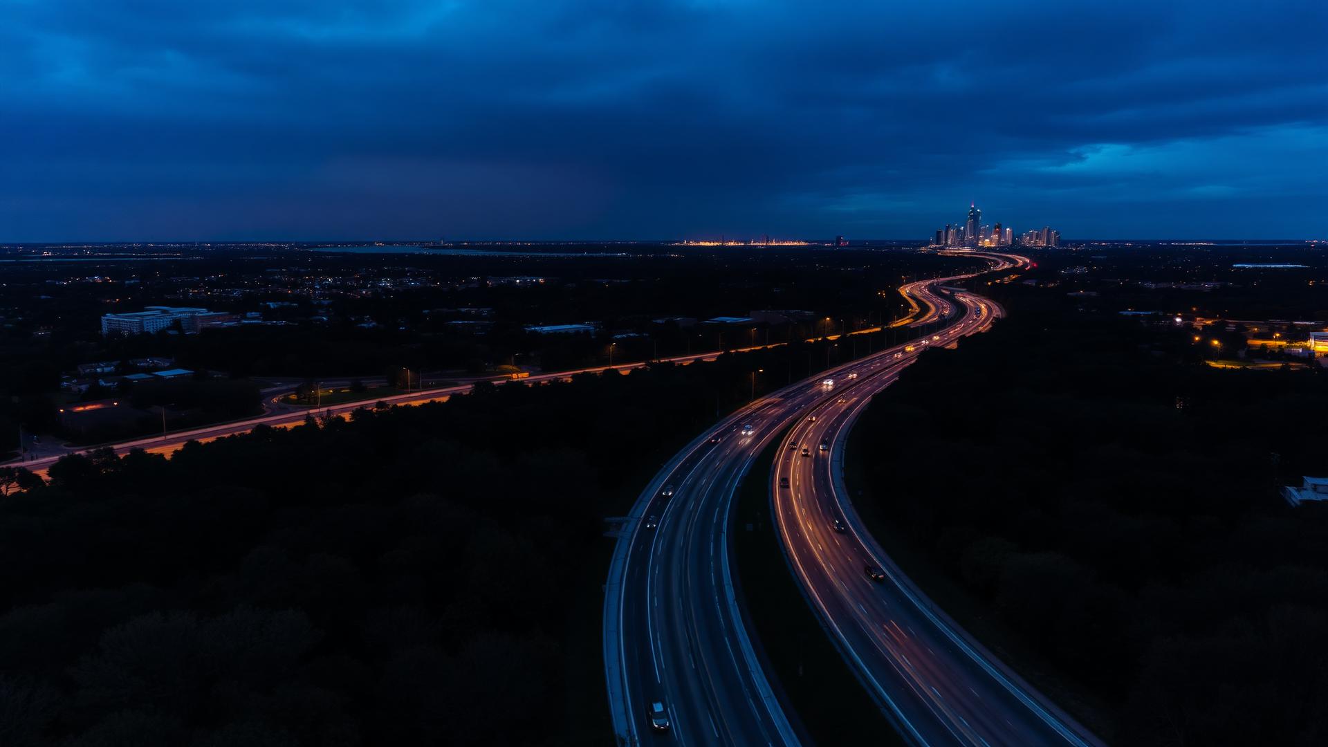 Long Island parkway at dusk with Manhattan skyline in the distance